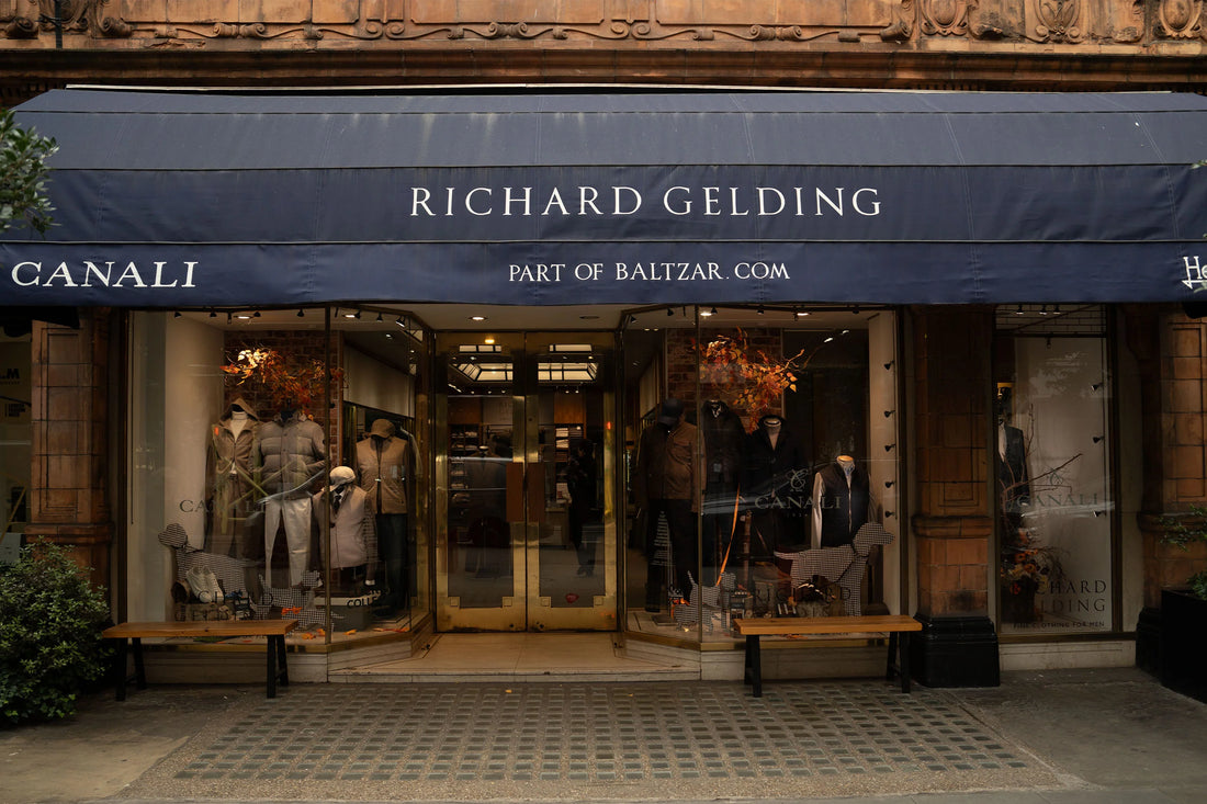 Exterior of the richard gelding clothing store displaying elegant fashion in the storefront windows.