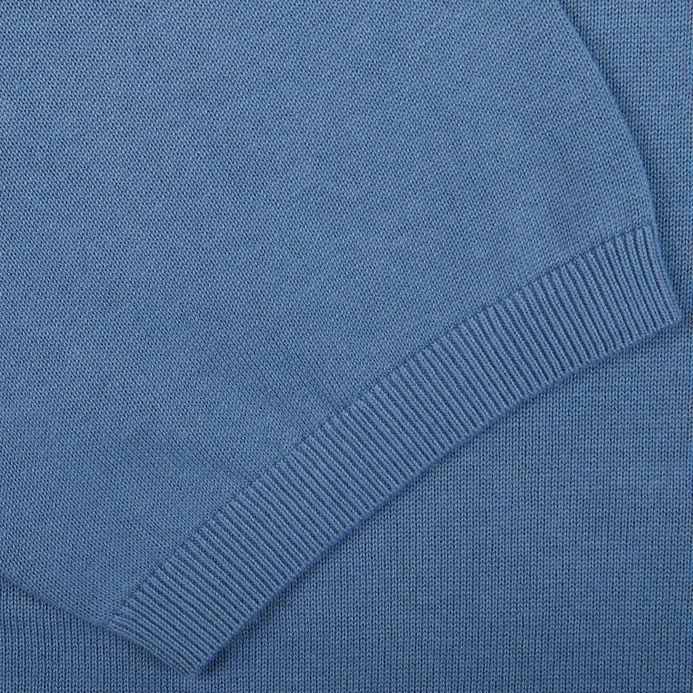 Close-up of airforce blue fabric with ribbed texture detailing, perfect for an Alan Paine Airforce Blue Knitted Cotton Polo Shirt.
