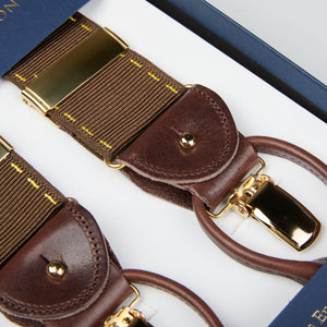 A pair of dark brown handmade Brown Yellow Stitching 40mm Braces in a box, by British brand Albert Thurston.