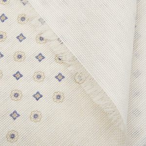 Close-up of a textured Cream Medallion Printed Linen Cotton Scarf with a fringe edge by Amanda Christensen.