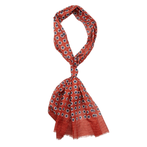 A patterned orange and white Amanda Christensen scarf with fringe on a white background.