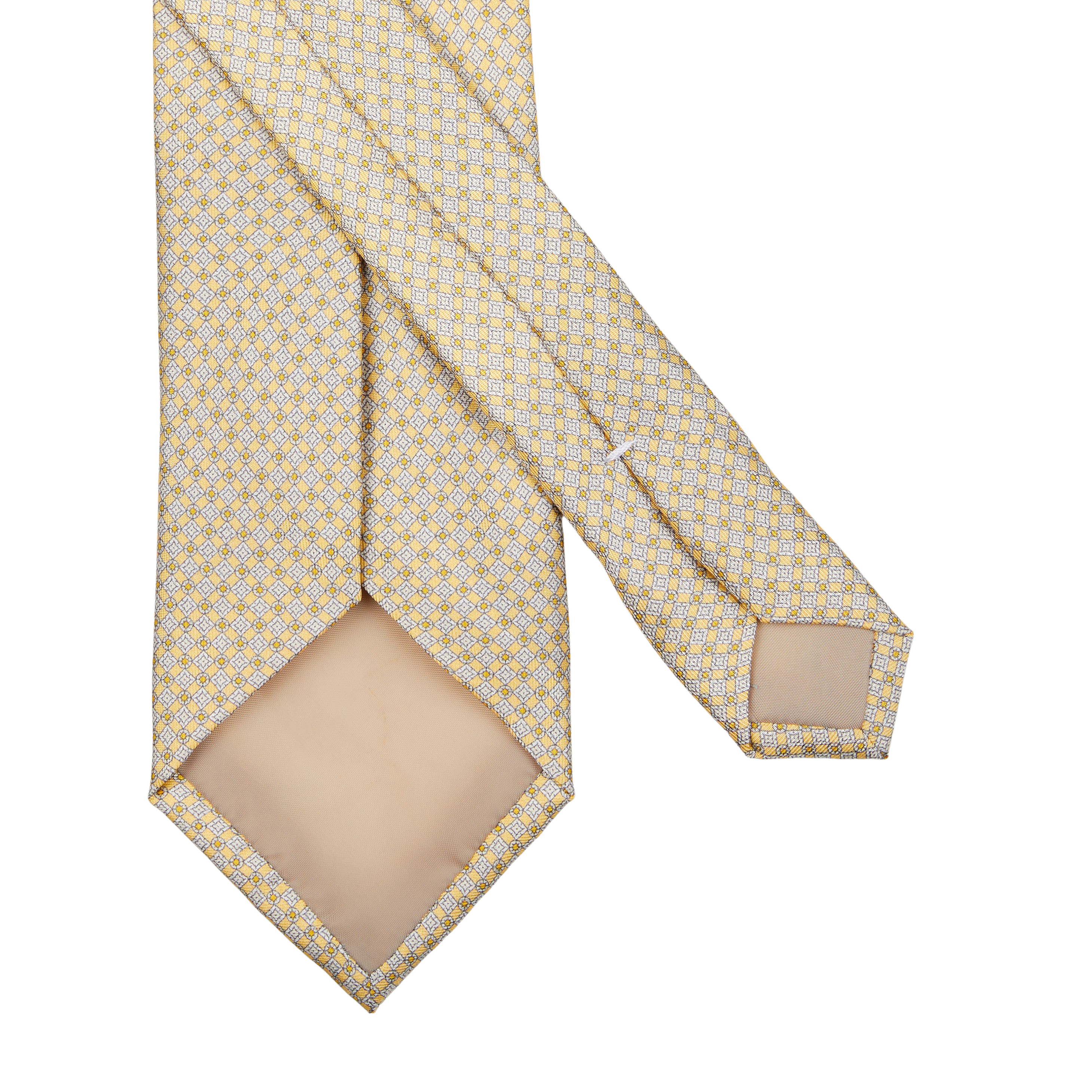 Yellow and white polka dot pure silk tie
could be rewritten as: 
Yellow Micro Medallion Printed Silk Lined Tie by Amanda Christensen.