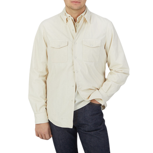 A man wearing an Off-White Cotton Padded Overshirt and jeans by Aspesi.