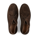 A pair of dark chestnut, vegetable-tanned suede Astorflex Driftflex unlined boots with laces, viewed from above.