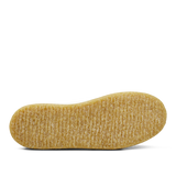 A single yellow rice crispy snack bar isolated on a white Astorflex Tenniflex Sneakers background.