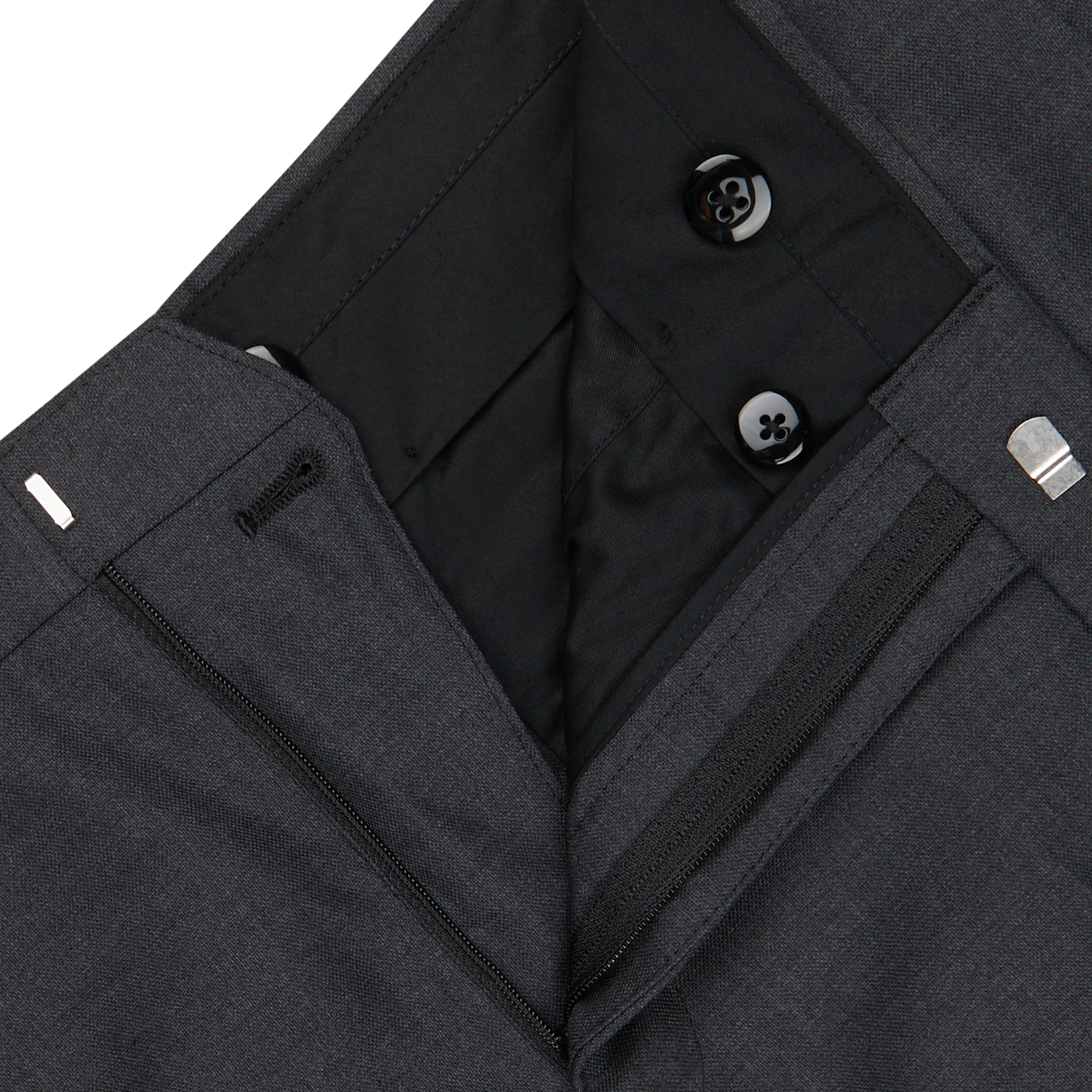 Close-up of a Baltzar Sartorial grey Super 100's Wool Flat Front Suit Trousers with visible button, zipped pocket, and classic tailored fit inner lining details.