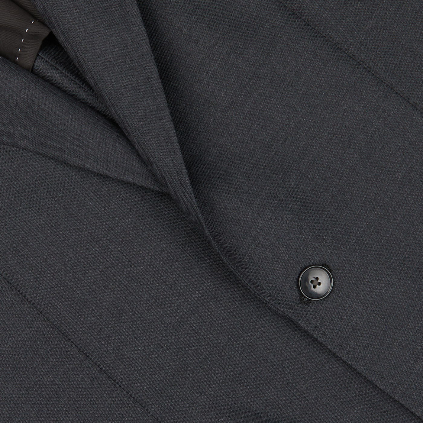Close-up of a Baltzar Sartorial Grey Super 100's Wool Suit Jacket with detailed texture and a visible button.