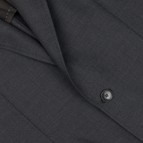 Close-up of a Baltzar Sartorial Grey Super 100's Wool Suit Jacket with detailed texture and a visible button.