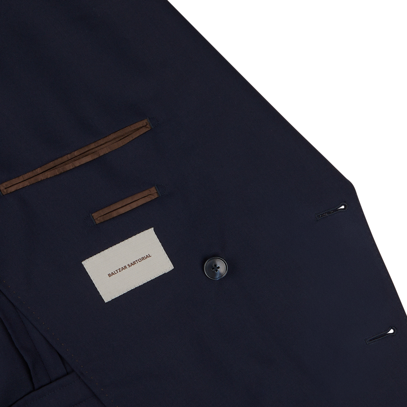 A close up of a Baltzar Sartorial Navy Blue Super 100s Wool DB Suit Jacket.