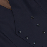 Close-up of a Baltzar Sartorial Navy Super 100s Wool DB Waistcoat with black buttons.