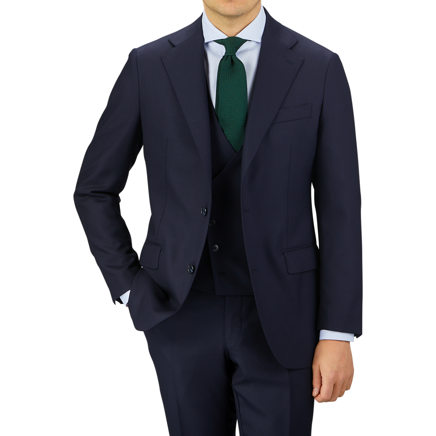 A professional man in a Baltzar Sartorial navy blue Super 100s wool three-piece suit with a white shirt, green tie, and no visible head.