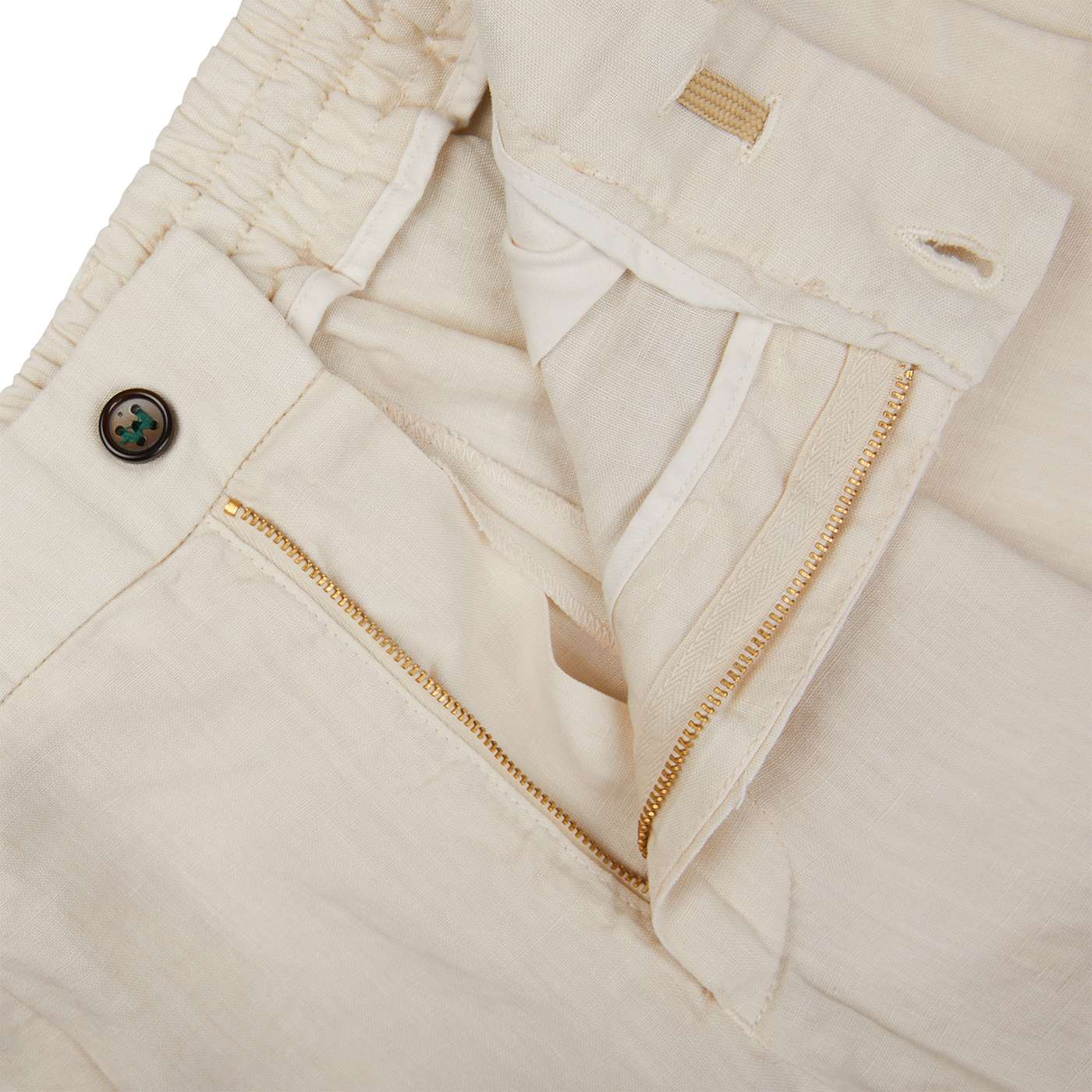 A pair of Cream Linen Twill Drawstring Trousers by Berwich with gold zippers.