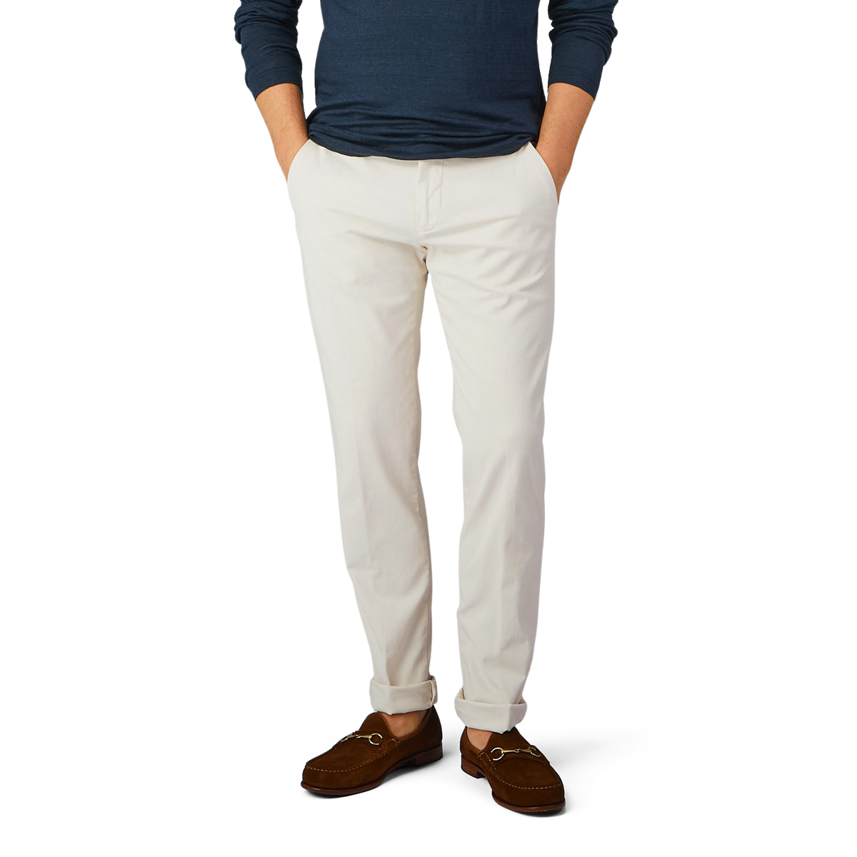A man in slim fit Light Beige Cotton Stretch Chinos from Berwich and a blue cotton shirt.