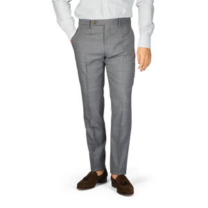 A man in a grey suit and white shirt with Berwich Medium Grey Wool Fresco Flat Front Trousers made from high-twist wool.