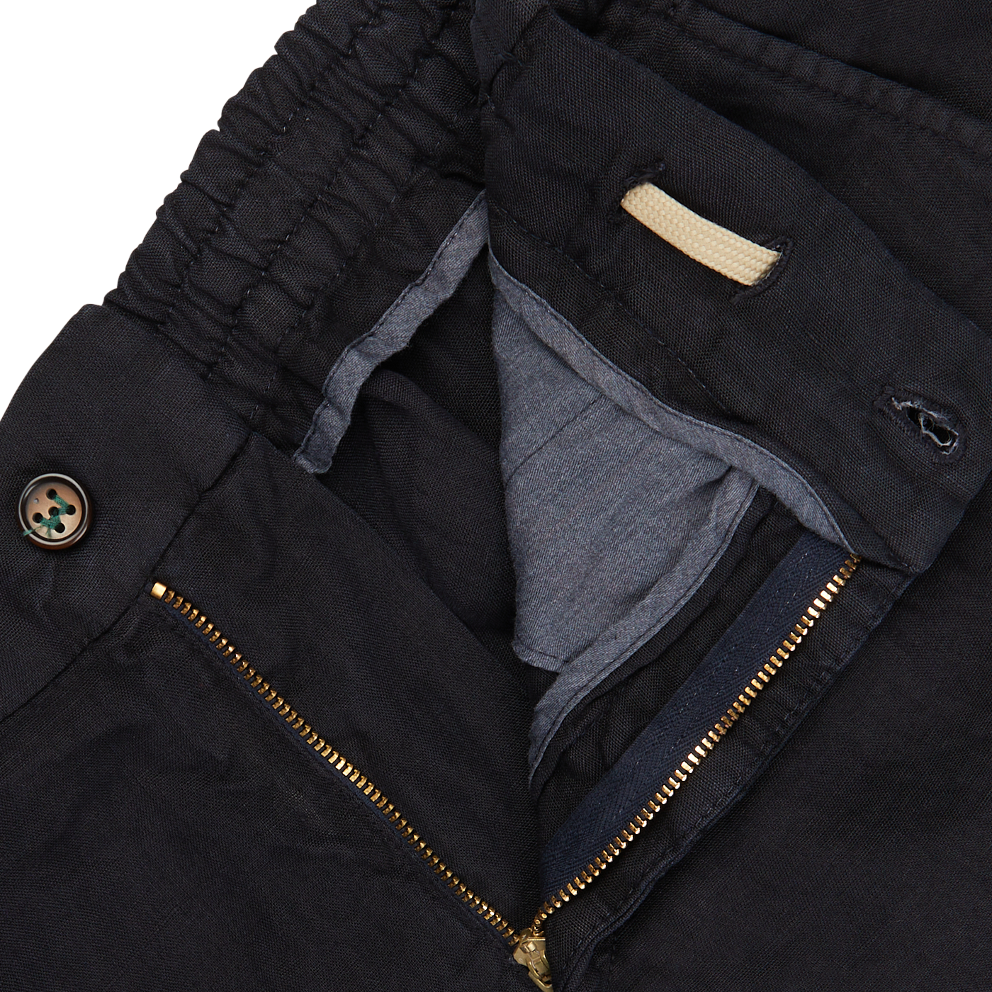 Close-up of a black jacket with a gold zipper partly open, revealing Navy Blue Washed Linen Drawstring Shorts by Berwich.