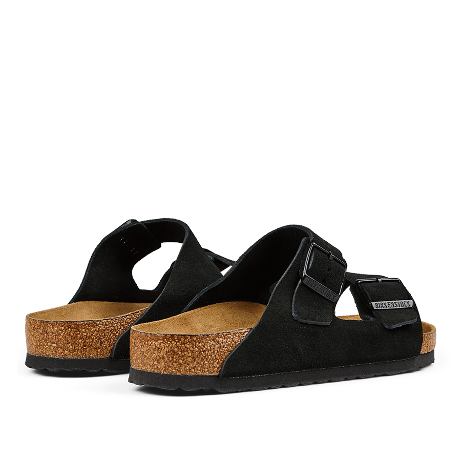 A pair of black, open-toed Birkenstock Arizona sandals with adjustable straps and cork footbeds.