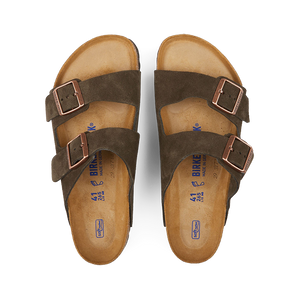 A pair of Mocha Brown Suede Leather Birkenstock Arizona sandals with adjustable straps and buckles, featuring contoured cork footbeds and flat soles.