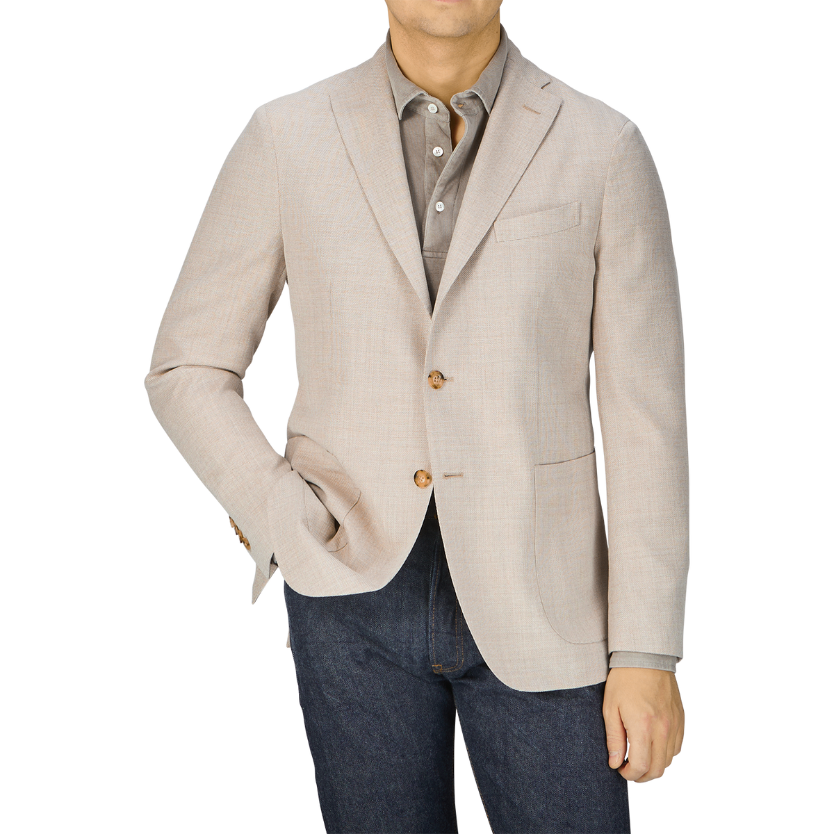 A man in a Boglioli Cream Beige Wool Hopsack K Jacket and jeans showcases unstructured craftsmanship.