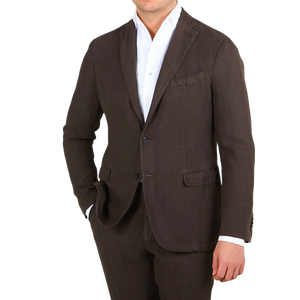 A man wearing a Boglioli Dark Brown Washed Linen Suit, exuding understated elegance.