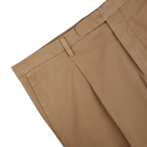 Boglioli's Tobacco Brown Washed Cotton Pleated Trousers with pleated front detail on a white background.