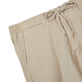 Beige Cotton Drawstring Malibu Shorts with elastic waist by Briglia on a white background.