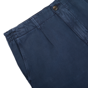Part of a Briglia navy blue pair of shorts with an adjustable waistband and a button closure.