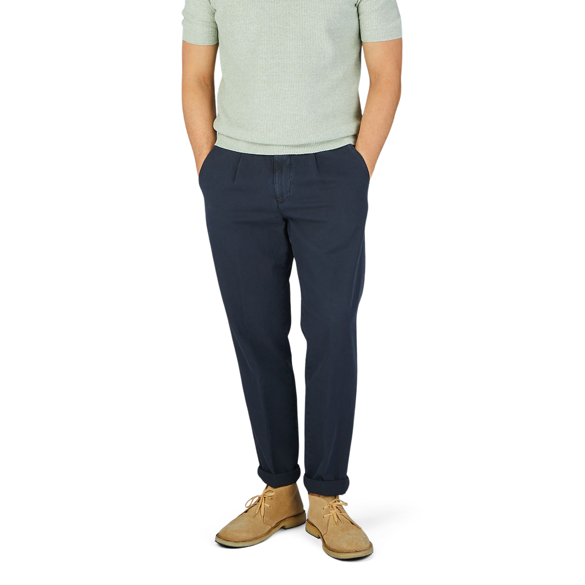 A man in Briglia navy blue cotton linen BG59 pleated chinos and a green t-shirt.