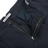 A pair of Navy Blue Cotton Linen BG59 Pleated Chinos with zippered pockets, made from an upcycled mix of cotton and linen. These Italian specialist Briglia pants are both stylish and functional.