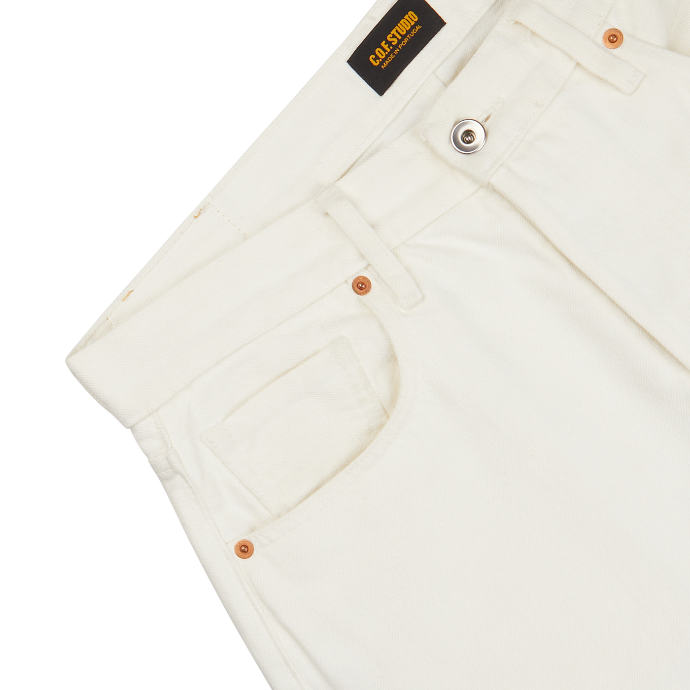 Close-up of white, organic Ecru Stone Washed Kuroki Cotton M5 jeans featuring a pocket and copper rivets, with a black 'C.O.F Studio' brand label visible.