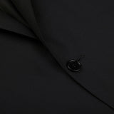 A close up of a timeless Canali Black Virgin Wool Twill Suit button.