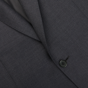 A close up of a formal charcoal grey Canali suit with buttons.