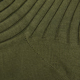 A close up of a Canali olive green sweater made of Egyptian cotton.