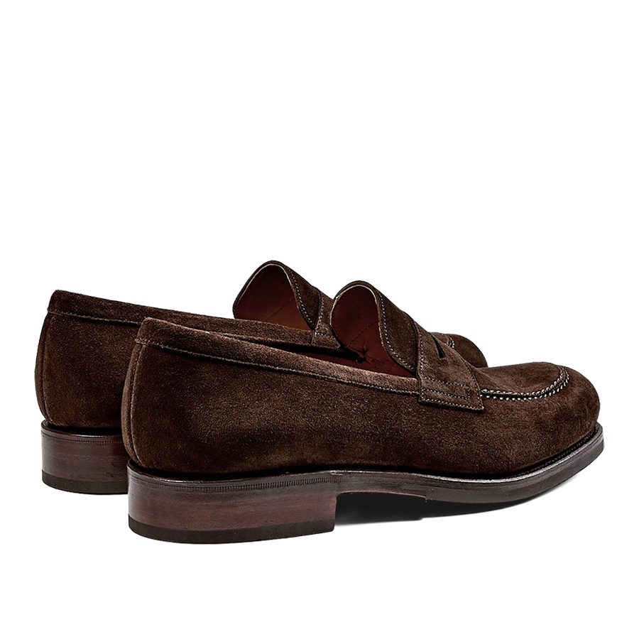 A pair of Brown Suede Forest Rubber Penny Loafers by Carmina, crafted by expert craftsmen, on a white background.