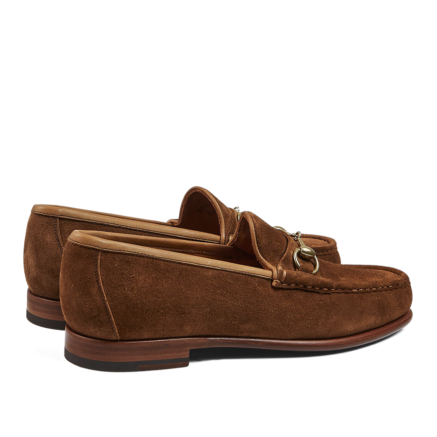 Pair of tobacco suede leather Xim Horsebit loafers with tassel details by Carmina.