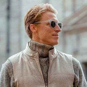 A man wearing Chimi sunglasses, showcasing the premium Model 02 Grey Gradient Lenses Sunglasses 47mm design, complete with a stylish vest.