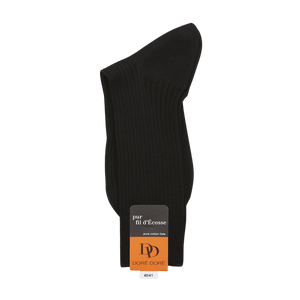 A pair of folded Black Cotton Fil d'Ècosse Ribbed Socks made from mercerised cotton with a label on a white background by Doré Doré.