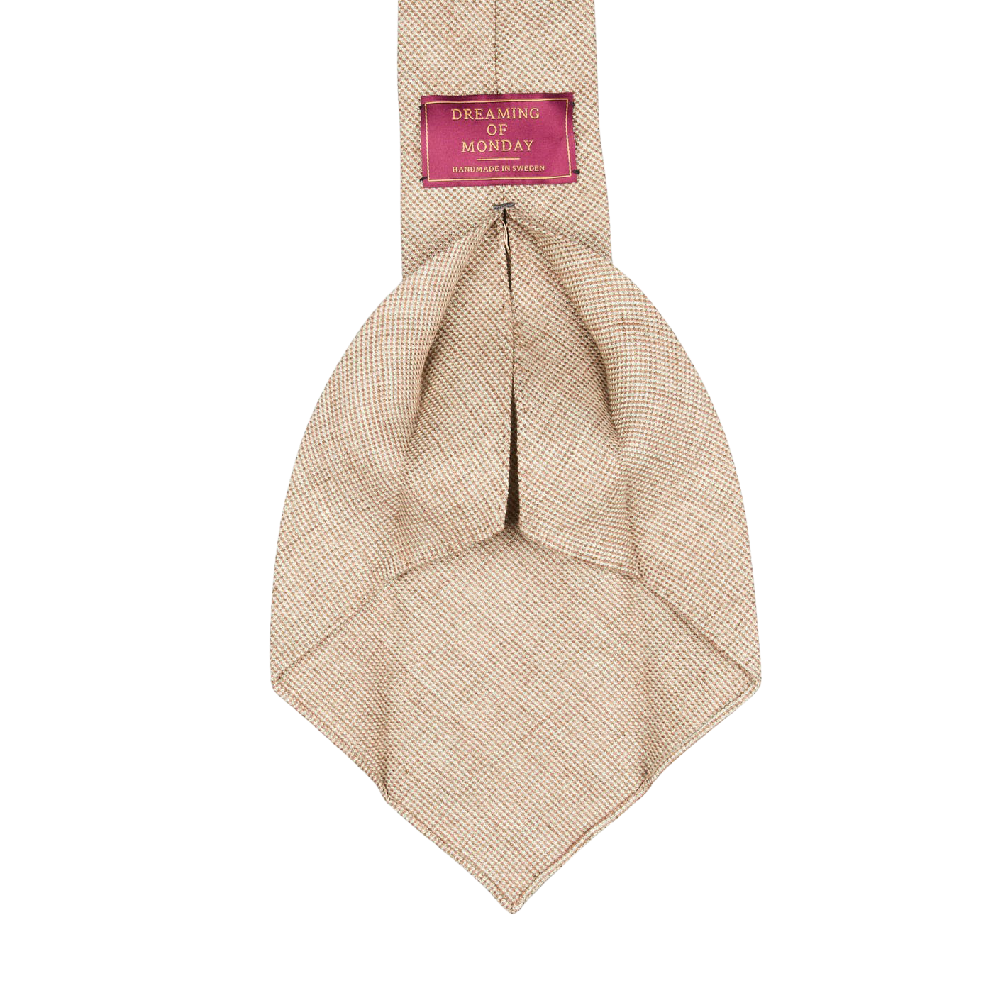 A Beige Melange 7-Fold French Linen Tie made by Dreaming Of Monday with a pink label on it.