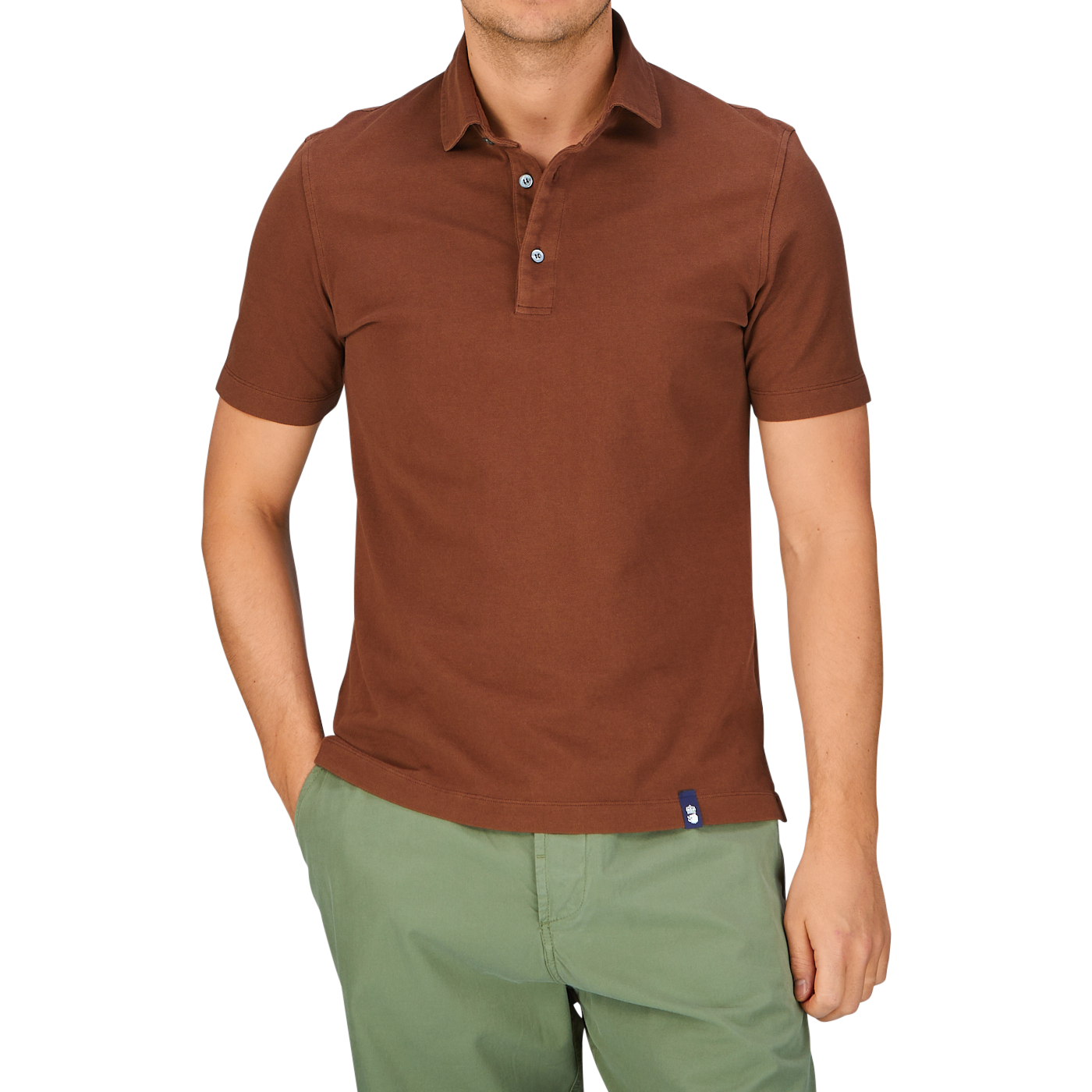 Man wearing a slim fit Drumohr Coffee Brown Cotton Piquet polo shirt and green shorts.