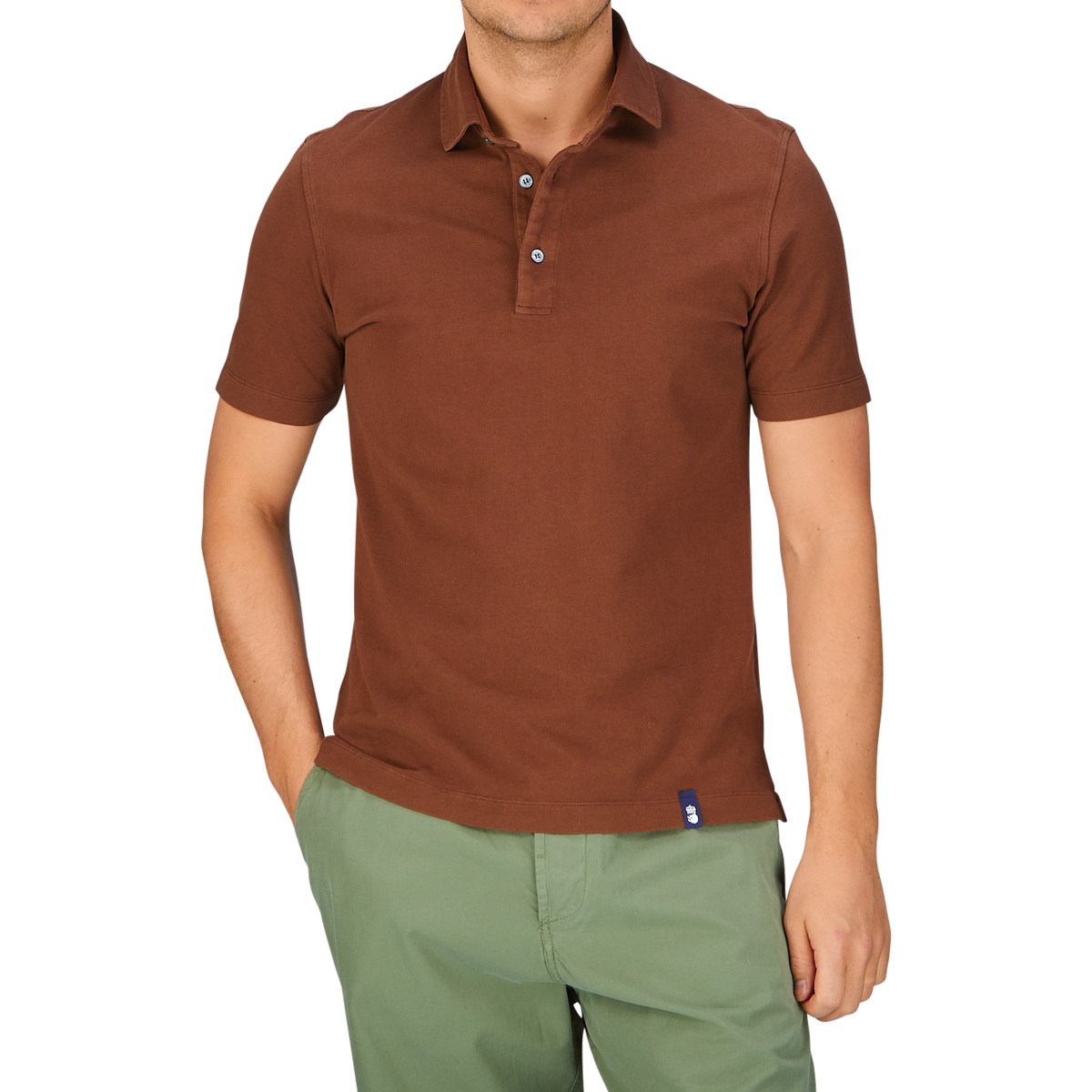Man wearing a slim fit Drumohr Coffee Brown Cotton Piquet polo shirt and green shorts.