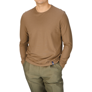 A man in a Drumohr Coffee Brown Ice Cotton LS T-Shirt and coffee brown pants.
