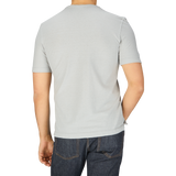 A man wearing a Drumohr Light Grey Cotton Linen T-Shirt in Italy.