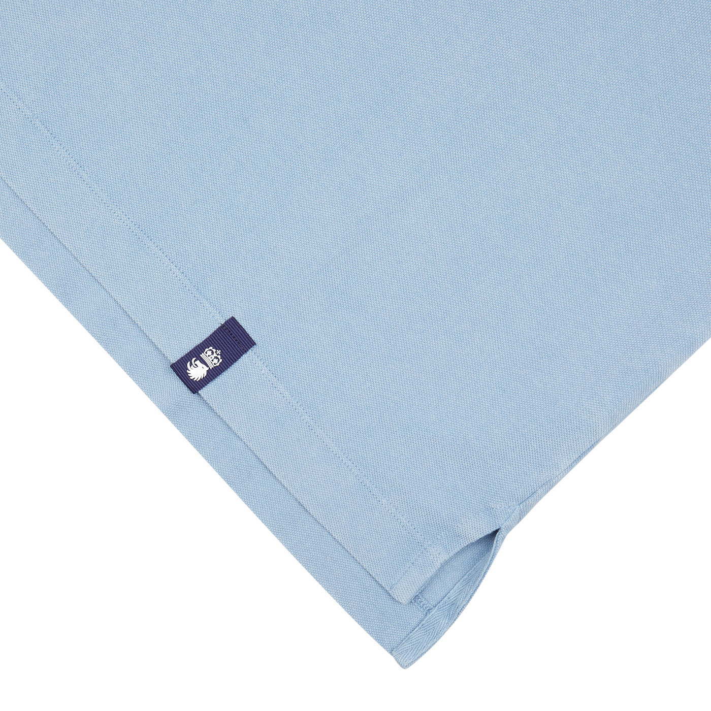 Sky Blue Cotton Piquet Polo Shirt fabric with a Drumohr clothing label from Italy.