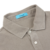 This taupe beige Cotton Piquet LS polo shirt features a blue label, originating from Italy by Drumohr.