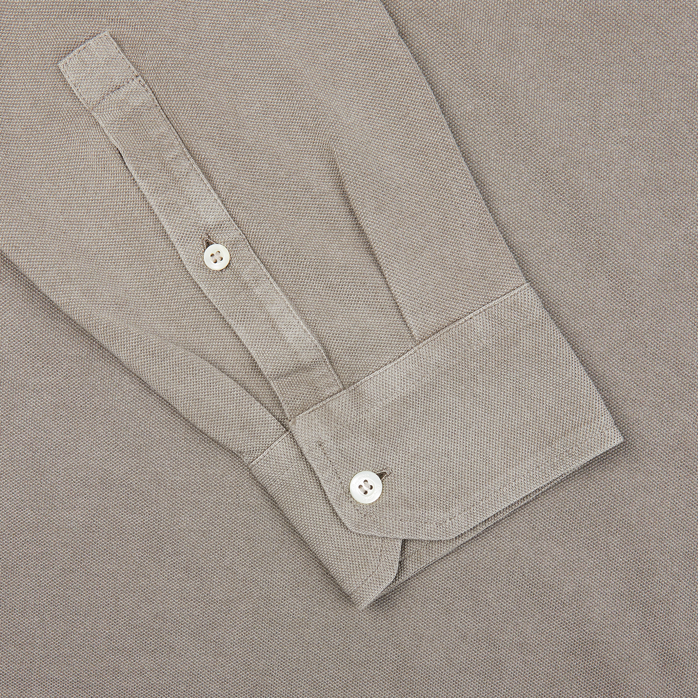 Close up of a taupe beige Drumohr Cotton Piquet LS Polo Shirt with buttons.