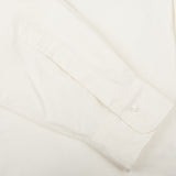 A close up of a Far East Manufacturing Ecru Beige Cotton Oxford BD Regular Shirt on a white surface.