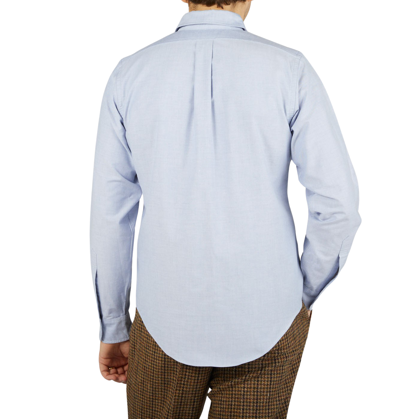 The back view of a man wearing a Far East Manufacturing Light Blue Cotton Oxford BD Regular Shirt and brown pants.
