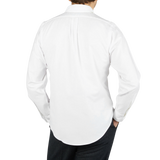 The back view of a man wearing a Far East Manufacturing White Cotton Oxford BD Regular Shirt.
