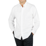 A man wearing a Far East Manufacturing White Cotton Oxford BD Regular Shirt.