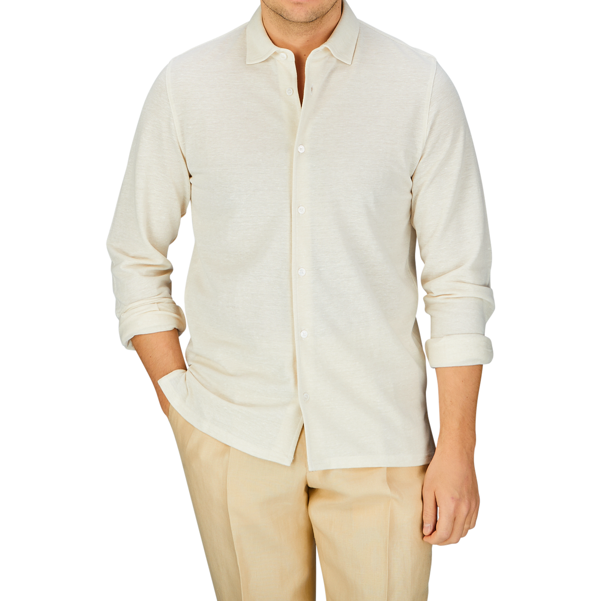 Man wearing a Fedeli Ecru Cotton Linen Piquet Polo Shirt and beige trousers.