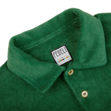 A Grass Green Cotton Towelling Polo Shirt with a Fedeli label on it.